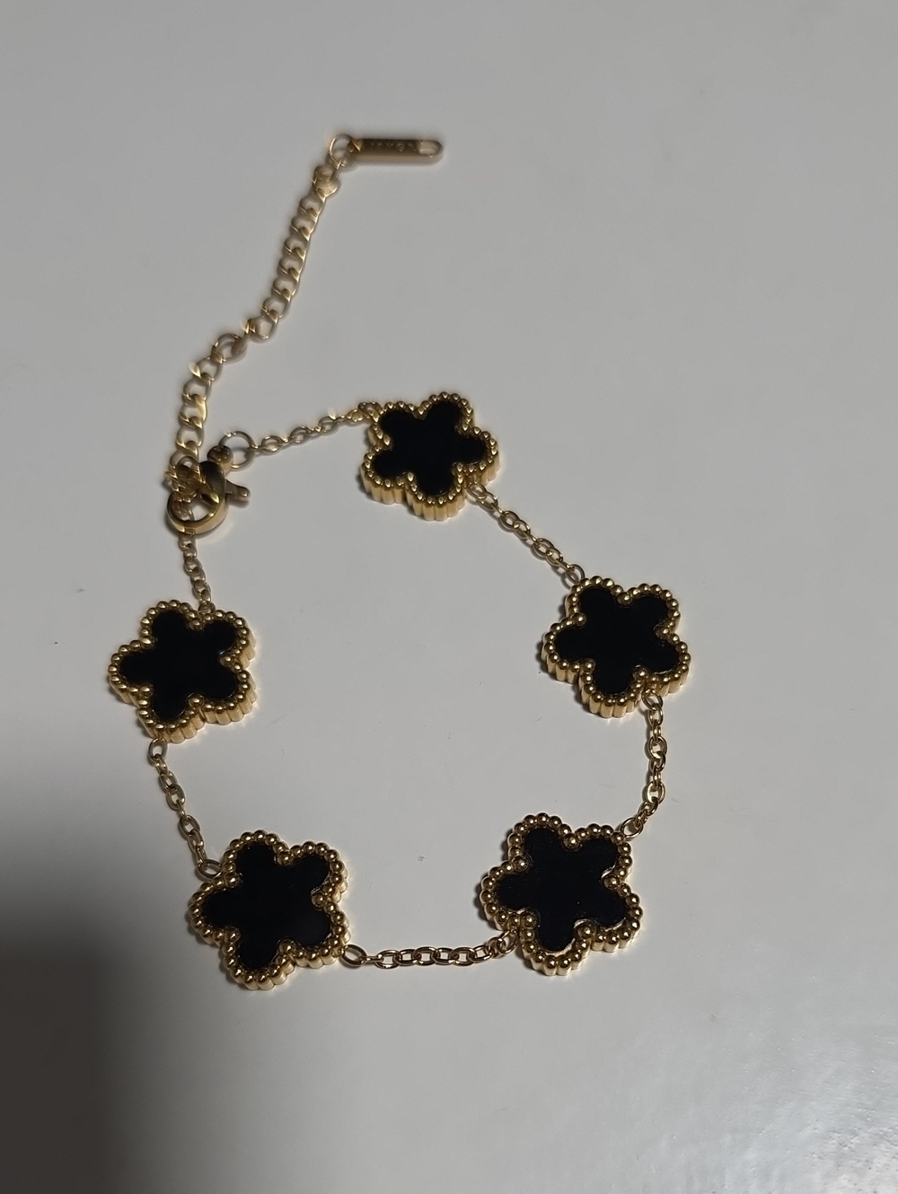 Gold Flower Link Bracelet with Black Inlay